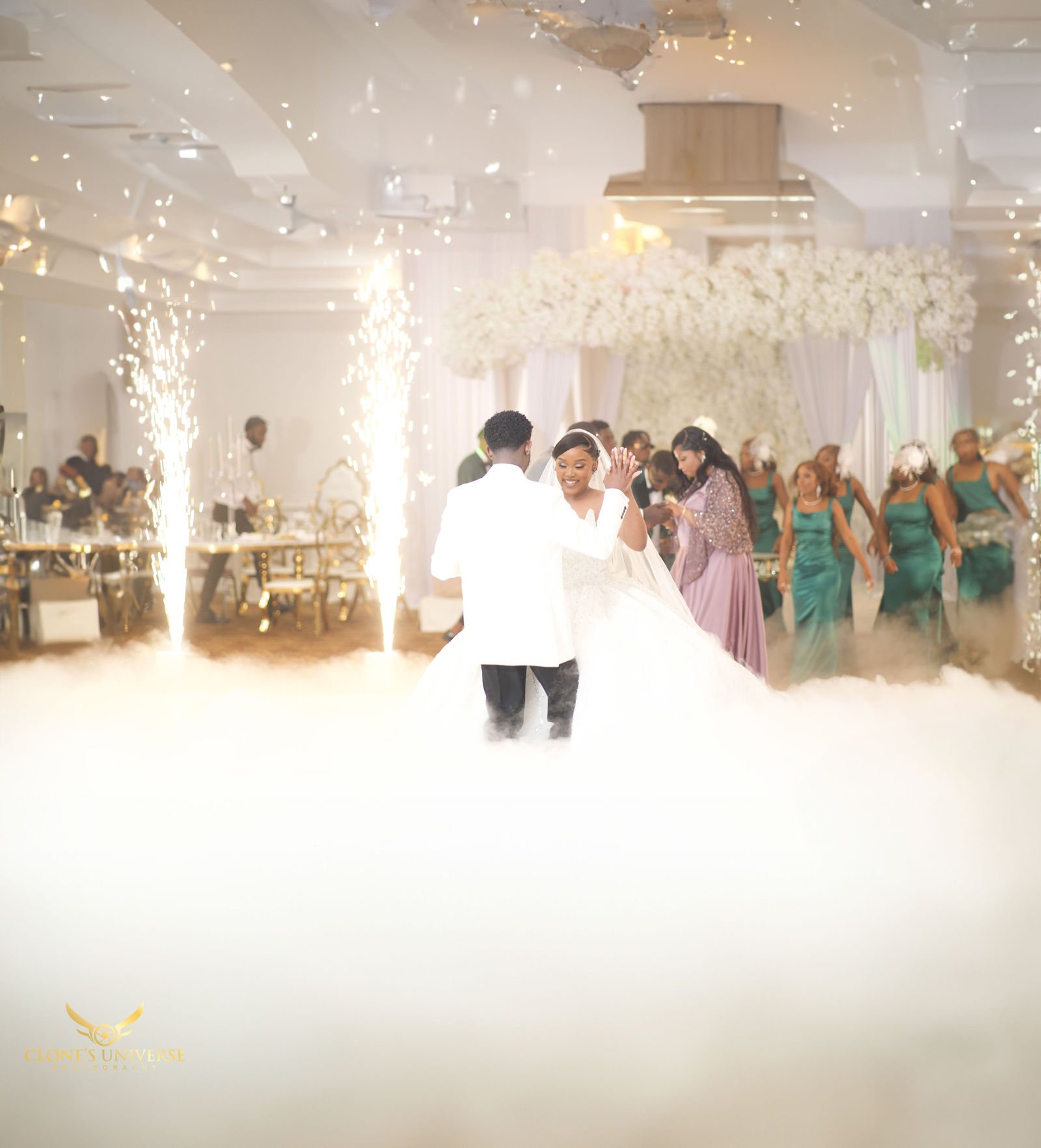 Couple’s grand entrance through low fog and sparklers